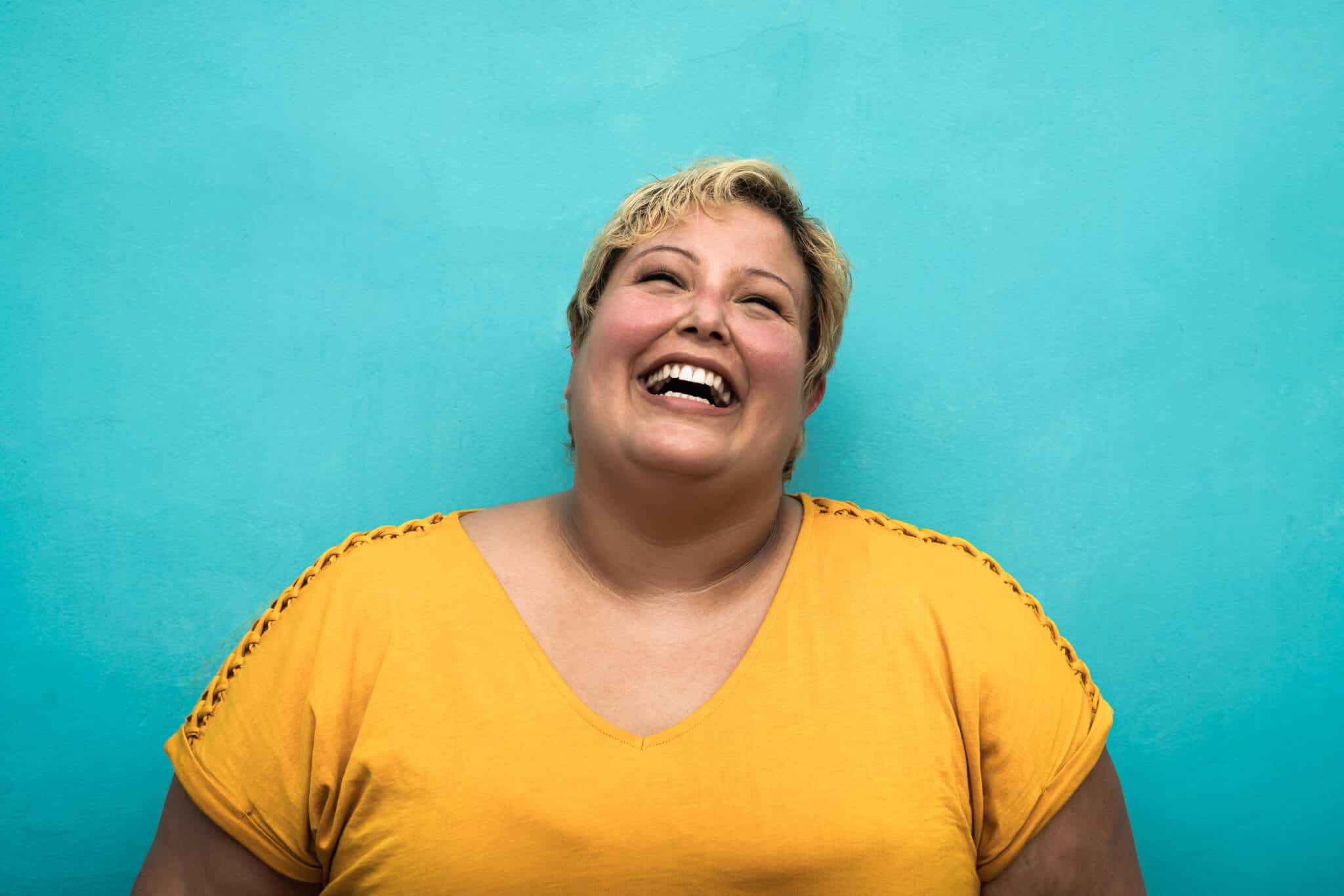 Happy plus size smiling woman portrait